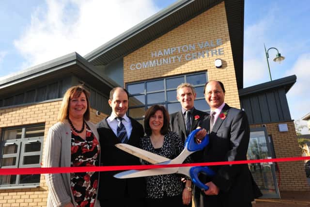 Shailesh Vara cuts the tape to open the new hampton vale community centre ENGEMN00120110411152631