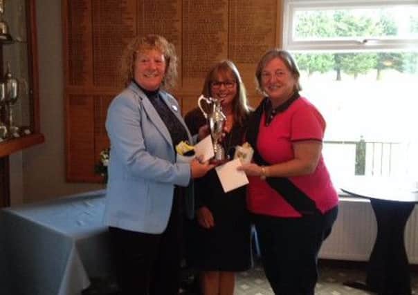 The Cambs & Hunts County Autumn Foursomes were held at March Golf Club and lady captain Fiona Wood (centre) is pictured presenting the winners trophy to Cambs & Hunts president Jacquie Richardson and Linda Harness.