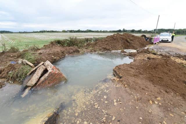 Road to stay closed for several days following burst water main in ...