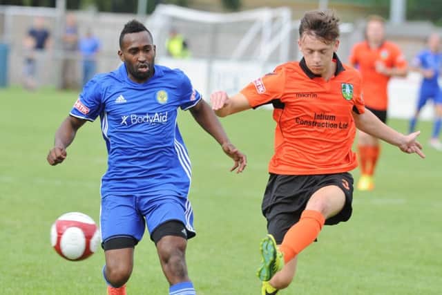 Avelino Vieira (blue) bagged a hat-trick for Peterborough Sports at Rothwell Corinthians.