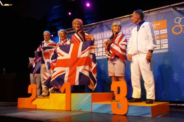 Georgina Jennings on top of the podium at the World Championships in Rotterdam.
