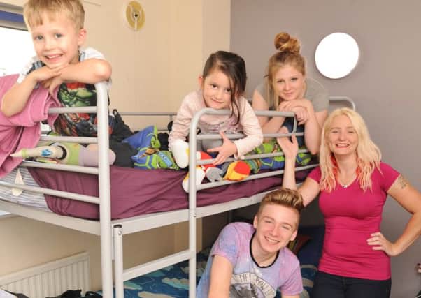 Joanne Parsons with her family Jordan Coulson (17), Jaycee Parsons (15), Josh Parsons (6) and Ellie Riley (6) in their two room accommadation at Hope House EMN-170919-165727009