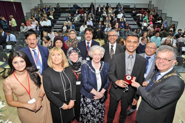 Deputy Mayor Coun. Chris Ash and Deputy Mayoress Doreen Roberts with student  Ballal Shabir (3rd right)  with organisers and guests  of the Muslim Council of Peterborough Education Awards at Jack Hunt Schoiol. EMN-170921-083103009
