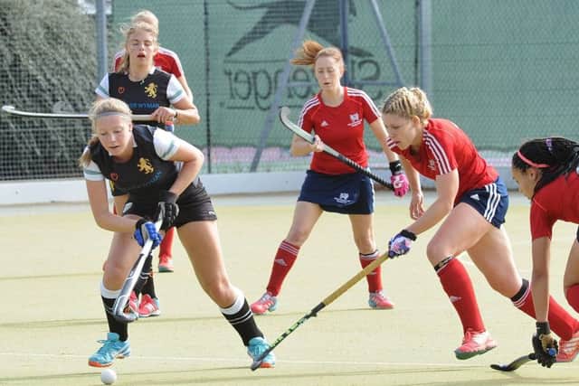 Anna Faux stretches for the ball during City of Peterborough Ladies' 5-1 win over Cambridge University. Photo: David Lowndes.