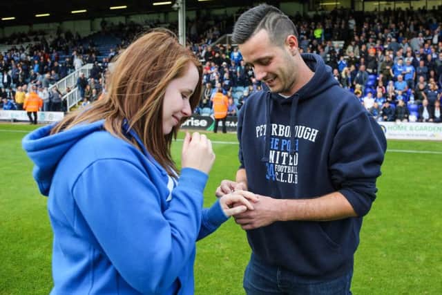 Anthony Tomlinson and Yasmin Black inspect the ring after a successful marriage proposal. Photo: Joe Dent/theposh.com.
