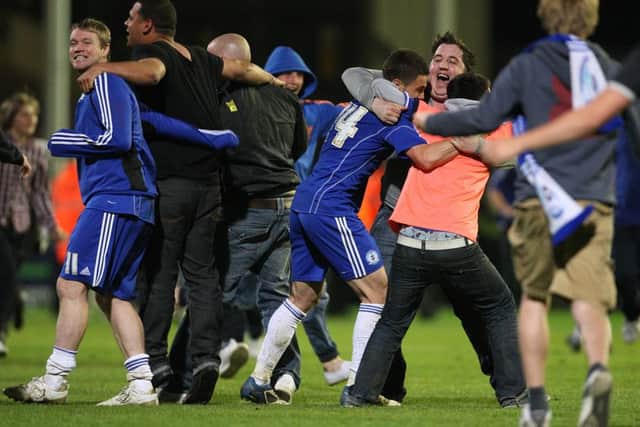 Posh players and fans after the 2011 League One play-off semi-final win over MK Dons.