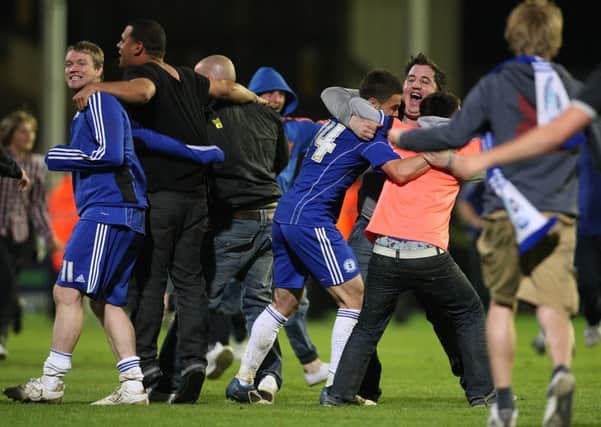 Posh players and fans after the 2011 League One play-off semi-final win over MK Dons.