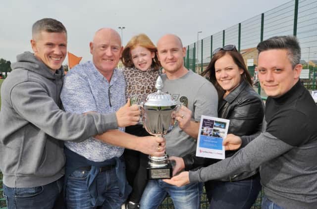 Paul McCann memorial football match at the Grange. Pictured are  Richard, Mick, Graham, Brooke and Kelly McCann with trophy sponsor Chris Moon.