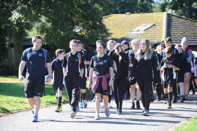 Nene Park Academy students taking part in a memorial walk for  former head Martin Bacon around Ferry Meadows.