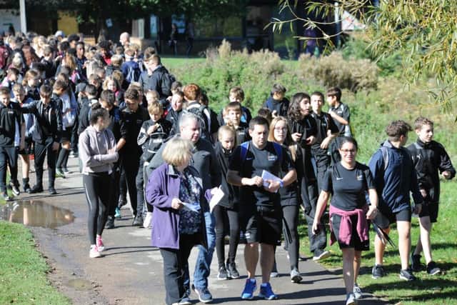 Nene Park Academy students taking part in a memorial walk for  former head Martin Bacon around Ferry Meadows.