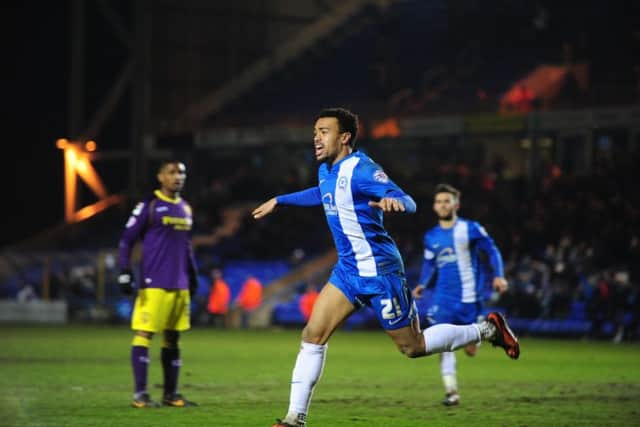 Nicky Ajose celebrates his hat-trick for Posh against Notts County.