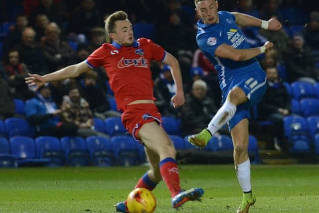 Posh star Marcus Maddison, who is 24 today, in action against Oldham.