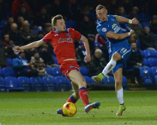 Posh star Marcus Maddison, who is 24 today, in action against Oldham.