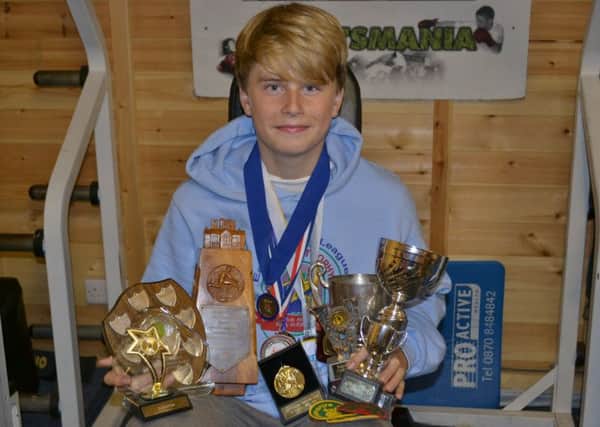 Donovan Capes with some of his trophies.