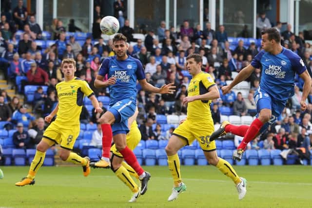 Posh defender Steven Taylor heads at goal in the heavy defeat at home to Oxford. Photo: Joe Dent/theposh.com.