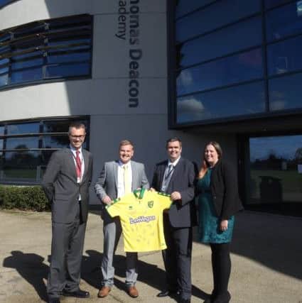 Dominic Knighton presents Geoff Walls with a signed Norwich City first team shirt. Also pictured are Ben Treverton (Sixth Form Leader) and Becky Brown (Head of PE).