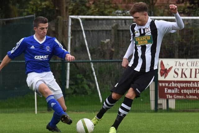 Connor Pilbeam (stripes) in action for Peterborough Northern Star against Rothwell Corinthians at the weekend. Photo: Chantelle McDonald. @cmcdphotos.
