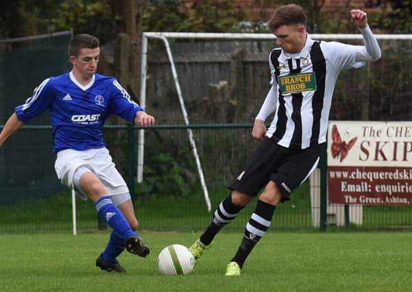 Connor Pilbeam (stripes) in action for Peterborough Northern Star against Rothwell Corinthians at the weekend. Photo: Chantelle McDonald. @cmcdphotos.