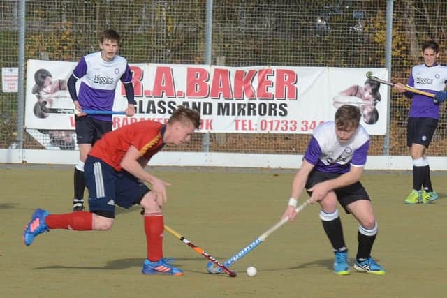 Ross Ambler (left) scored for City of Peterborough at Harleston.