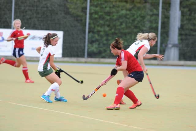 Action from City of Peterborough Ladies' (red) win over Norwich Dragons last weekend. Photo: David Lowndes.