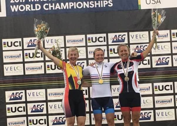 Lindsay Clarke (left) on the podium at the World Masters Championships in California.