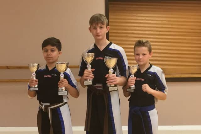 BKBA Team Assassins members, from left, Rohan Kumar, Christopher Bulpin and Bradley Bulpin.