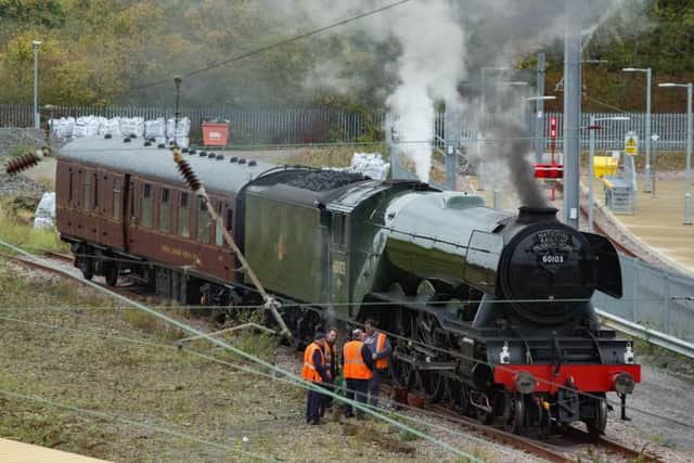 Engineers inspecting the Flying Scotsman in Peterborough today after it was forced to stop. 
Picture by Terry Harris / Peterborough Telegraph.