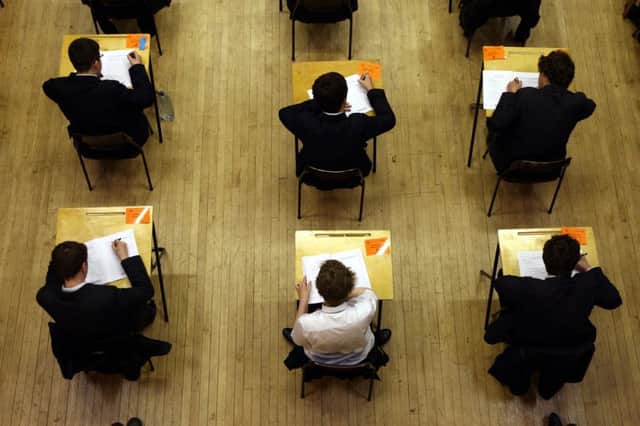 A general view of pupils sitting an exam at Lawrence Sheriff school Rugby, Warwickshire. SUS-170809-145500001