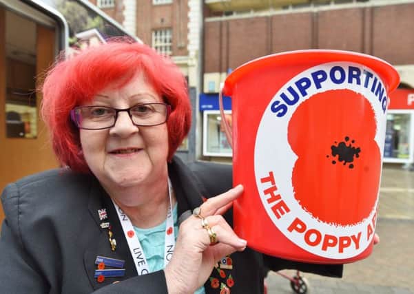 Red haired poppy collector Catherine Bennett. EMN-160111-154750009