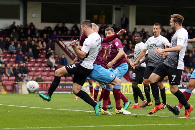 Andrew Hughes volleys home the Posh goal at Scunthorpe. Photo: Joe Dent/theposh.com.