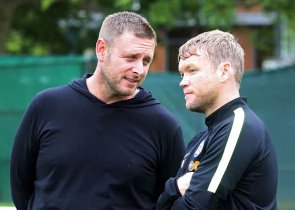 Posh chairman Darragh MacAnthony and manager Grant McCann.