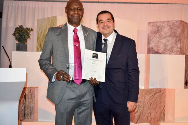Tony Francis being presented his award by Sacha Berendji, director of retail at M&S