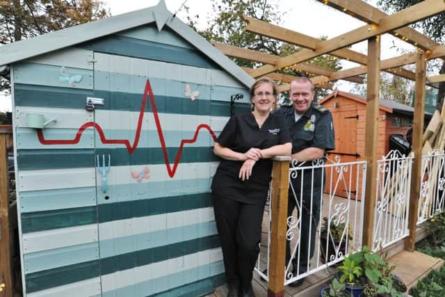 Stephen Wainwright, emergency medical technician and Catriona Thompson, emergency consultant with their sheds at the rear of their property in Stanground. 

REQUEST - PLEASE DON'T PUBLISH THEIR ADDRESS EMN-171024-185213009