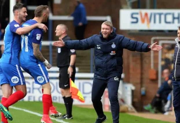 Marcus Maddison celebrates his goal with Grant McCann. Photo: Joe Dent