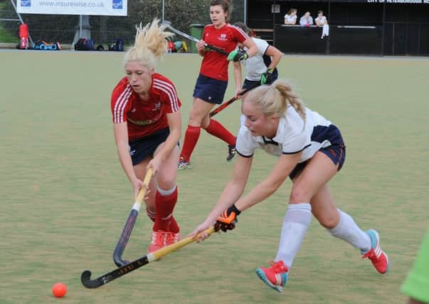 Action from City of Peterborough (red) v St Albans seconds. Photo: David Lowndes.
