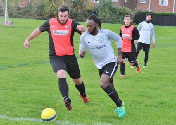 Action from FC Peterborough's 4-2 win over Parkway Eagles (red). Photo: David Lowndes.