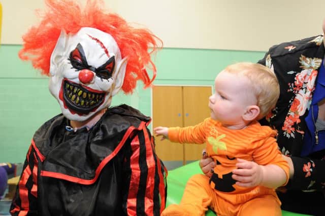 Halloween fundraiser for Amazon Ward  at City Hospital at Hampton Leisure Centre. Haiden Minnis (10 months) with masked visitor EMN-171029-152847009