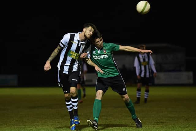Matt Cox (stripes) of Peterborough Northern Star in action against Sleaford. Photo: Chantelle McDonald. @cmcdphotos.