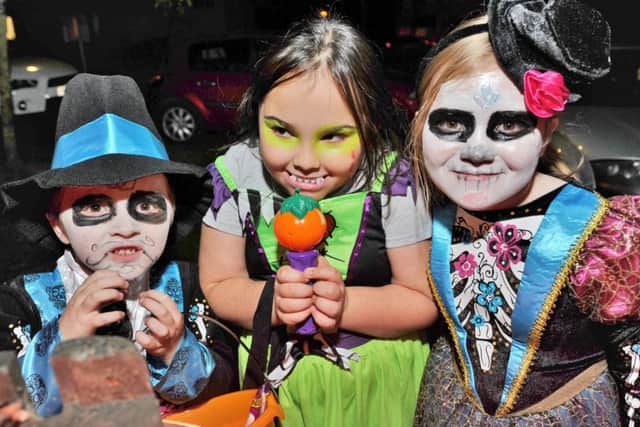 Halloween House at Bringhurst, Orton Goldhay. Young "treaters" Joshua Norman, Katlin Fraser and Kaitlin Norman EMN-171031-190833009