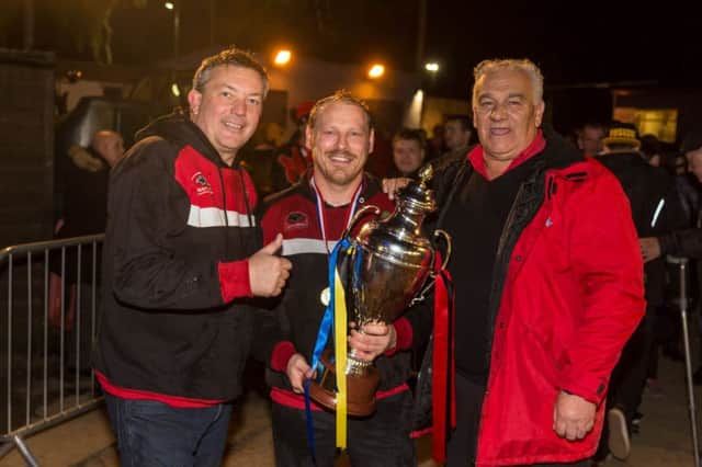Owner Ged Rathbone, team boss Carl Johnson and promoter Trevor Swales pictured with the KO Cup.