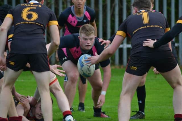 Peterborough Regional College player Owen Miller gets ready to pounce.