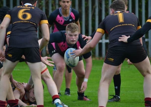 Peterborough Regional College player Owen Miller gets ready to pounce.