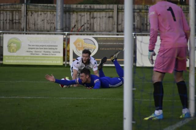 It's a penalty for Peterborough Sports as Josh Moreman is fouled by a Basford United defender. Photo: James Richardson.