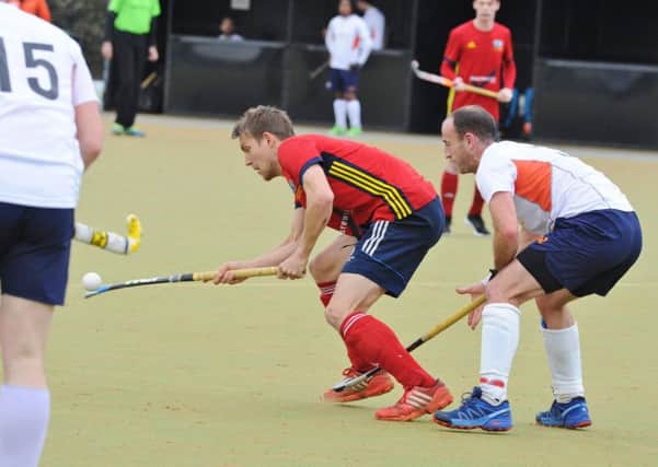 Ben Read (red) in action for City of Peterborough against St Albans. Photo: David Lowndes.