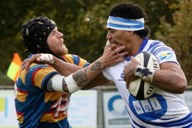 An Old Halesonians player gets right up Lions centre Sitanilei Tei Semisis nose. Picture: Mick Sutterby