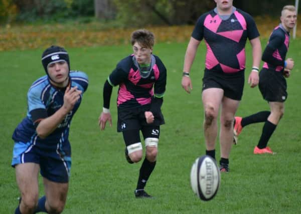 Alex Baker in action for Peterborough Regional College against Hills Road.