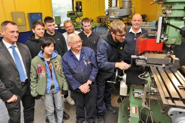 Vogal Group apprentices including Arturs Suna (at machine) with staff and managing director Rob Gault.