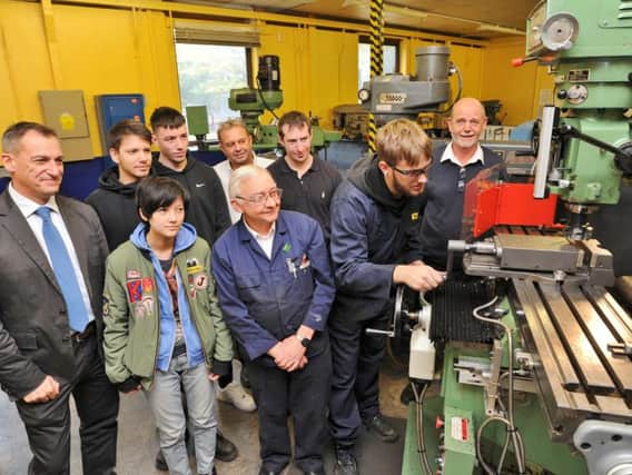 Vogal Group apprentices including Arturs Suna (at machine) with staff and managing director Rob Gault.