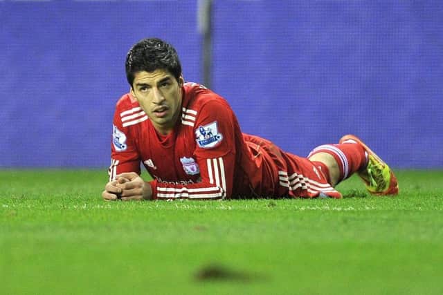 Luis Suarez on the floor again during his time at Liverpool.