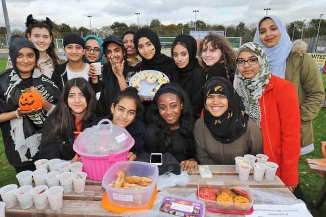 Youngsters from ther NCS group fundraising for the ambulance service at the Peterborough Town sports ground EMN-171024-184938009